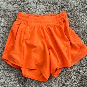 COPY - Lululemon neon orange 4 inch hotty hots, size 2 tall